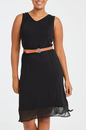 Model Noli wearing size L of the Reversible Essential Slip Dress in colour Black (Black), from the front, cropped image