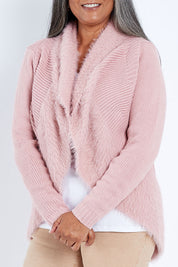 Model Nadine wearing size S of the Faux Fur Cardigan in colour Rose (Pink), from the front, cropped image