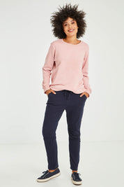 Model Olivia wearing size S of the Jogger Jean in colour Navy (Blue), from the front, showing the whole outfit