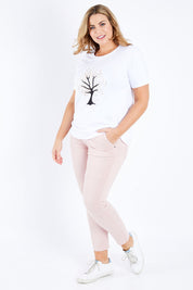 Model Fiona wearing size XL of the Jogger Jean in colour Pink (Pink), from the front, showing the whole outfit