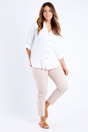 Model Laura wearing size L of the Lightweight Jogger Jean in colour Palepink (Pink), from the front, showing the whole outfit