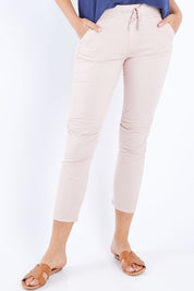 Model Madeline wearing size S of the Lightweight Jogger Jean in colour Palepink (Pink), from the front, cropped image