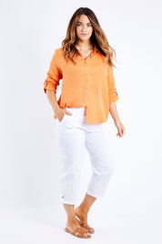 Model Laura wearing size L of the Santorini Cotton Pant in colour White (White), from the front, showing the whole outfit