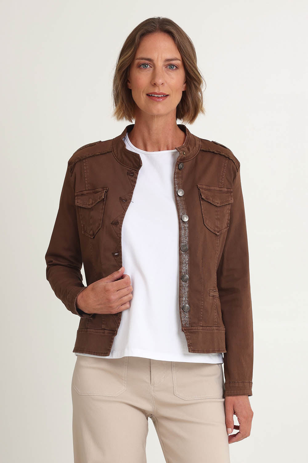 Model Riina wearing size S of the Military Denim Jacket in colour Chocolate, from the front, cropped image