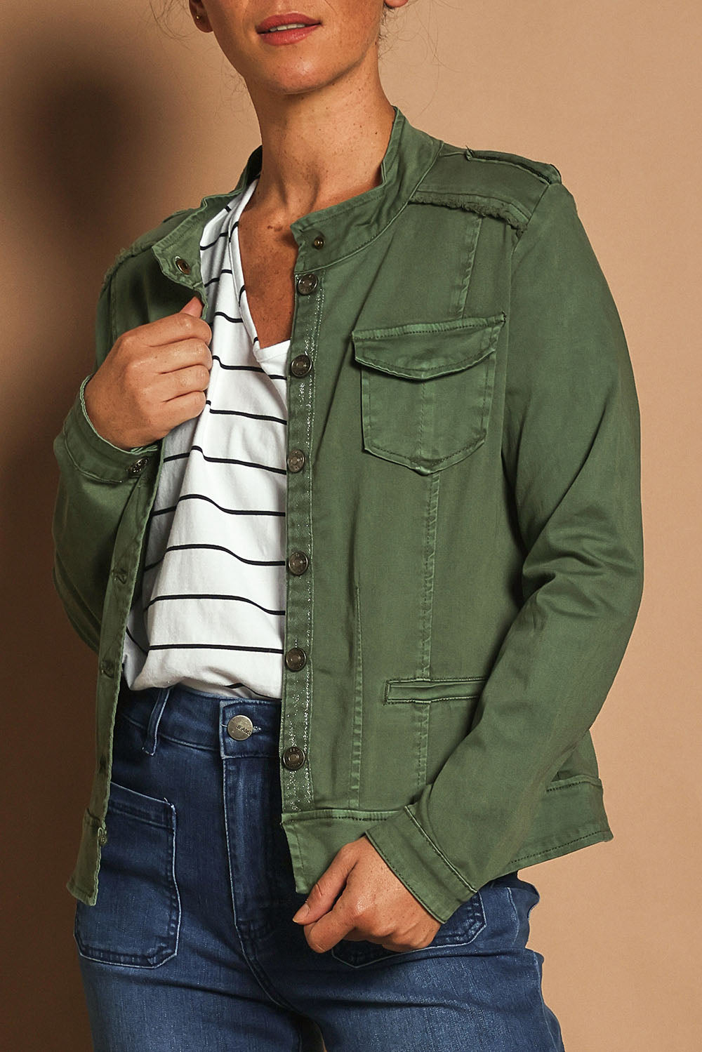 Model Katie wearing size S of the Military Denim Jacket in colour Khaki (Green), from the front, cropped image