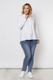 A model wearing the Poplin Shirt in colour White (White), from the front, showing the whole outfit