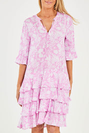 Model Kelly wearing size S of the Print Layered Dress in colour Lolly (Pink), from the front, cropped image
