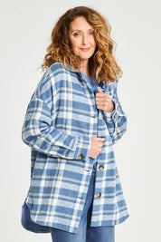 Model Emma wearing size S of the Perisher Check Shacket in colour Cornflower (Blue), from the front, cropped image
