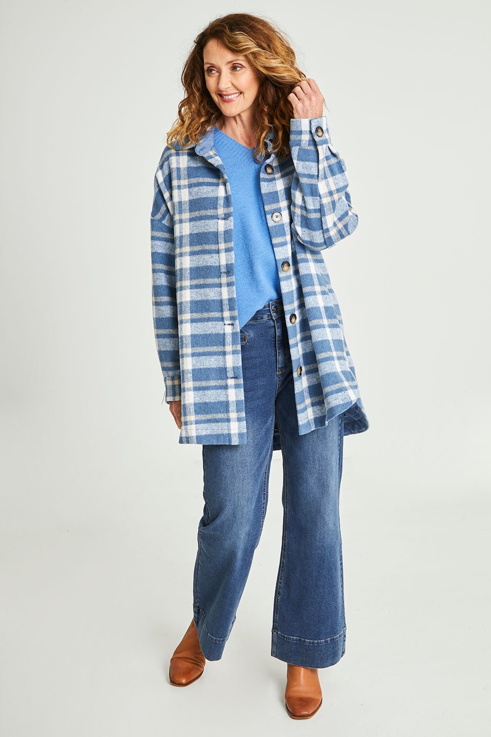 Model Emma wearing size S of the Perisher Check Shacket in colour Cornflower (Blue), from the front, showing the whole outfit