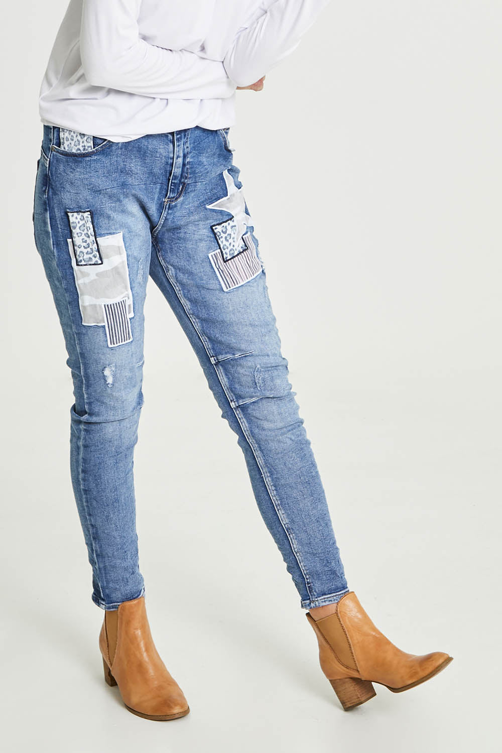 Model Emma wearing size S of the Stella Patch Denim Jean in colour Denim (Blue), from the front, showing the whole outfit