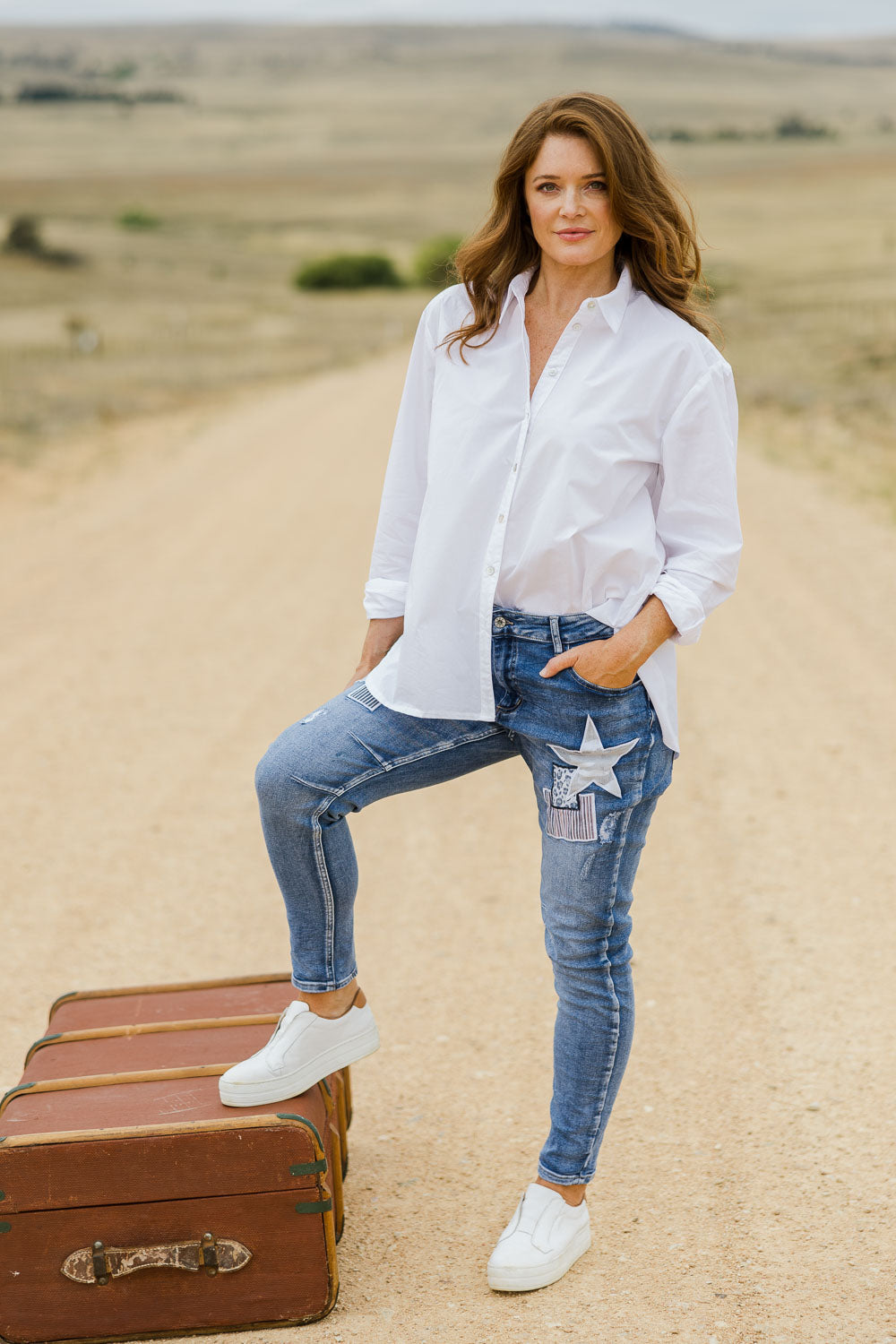 Model Sally wearing size S of the Stella Patch Denim Jean in colour Denim (Blue), from the front, showing the whole outfit