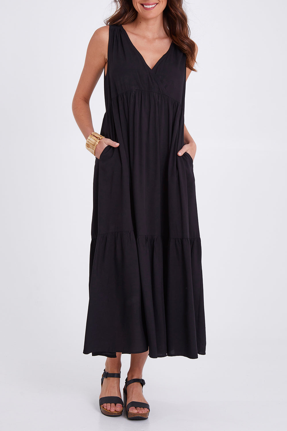 Model Madeline wearing size S of the Hamilton Dress in colour Black (Black), from the front, cropped image
