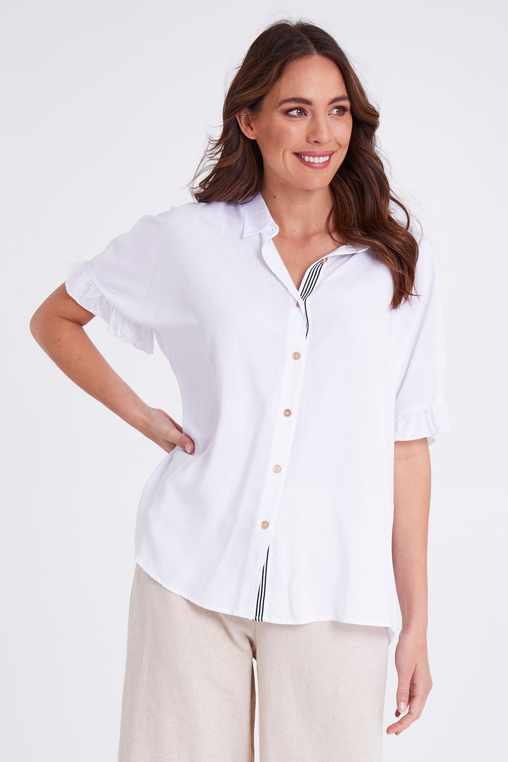 Model Madeline wearing size S of the Kylie Shirt in colour White (White), from the front, cropped image