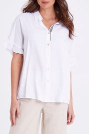 Model Madeline wearing size S of the Kylie Shirt in colour White (White), from the front, cropped image