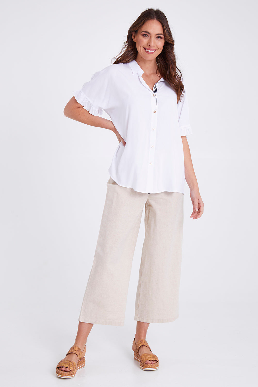 Model Madeline wearing size S of the Kylie Shirt in colour White (White), from the front, showing the whole outfit