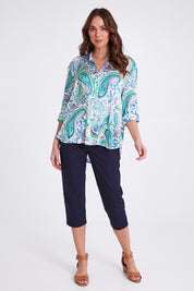 Model Madeline wearing size S of the Vibe Satin Shirt in colour Green (Green), from the front, showing the whole outfit
