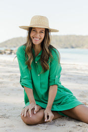Model Alex wearing size S of the Byron Cotton Dress in colour Green (Green), from the front, showing the whole outfit