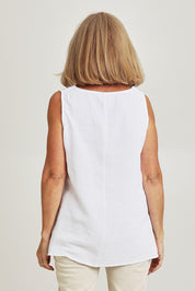 Model Sandy wearing size S of the Byron Cotton Tank in colour White (White), from the back