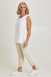 Model Sandy wearing size S of the Byron Cotton Tank in colour White (White), from the front, showing the whole outfit