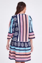 Model Madeline wearing size S of The Bondi Cotton Dress in colour Navymulti (Blue), from the back