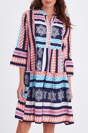 Model Madeline wearing size S of The Bondi Cotton Dress in colour Navymulti (Blue), from the front, cropped image