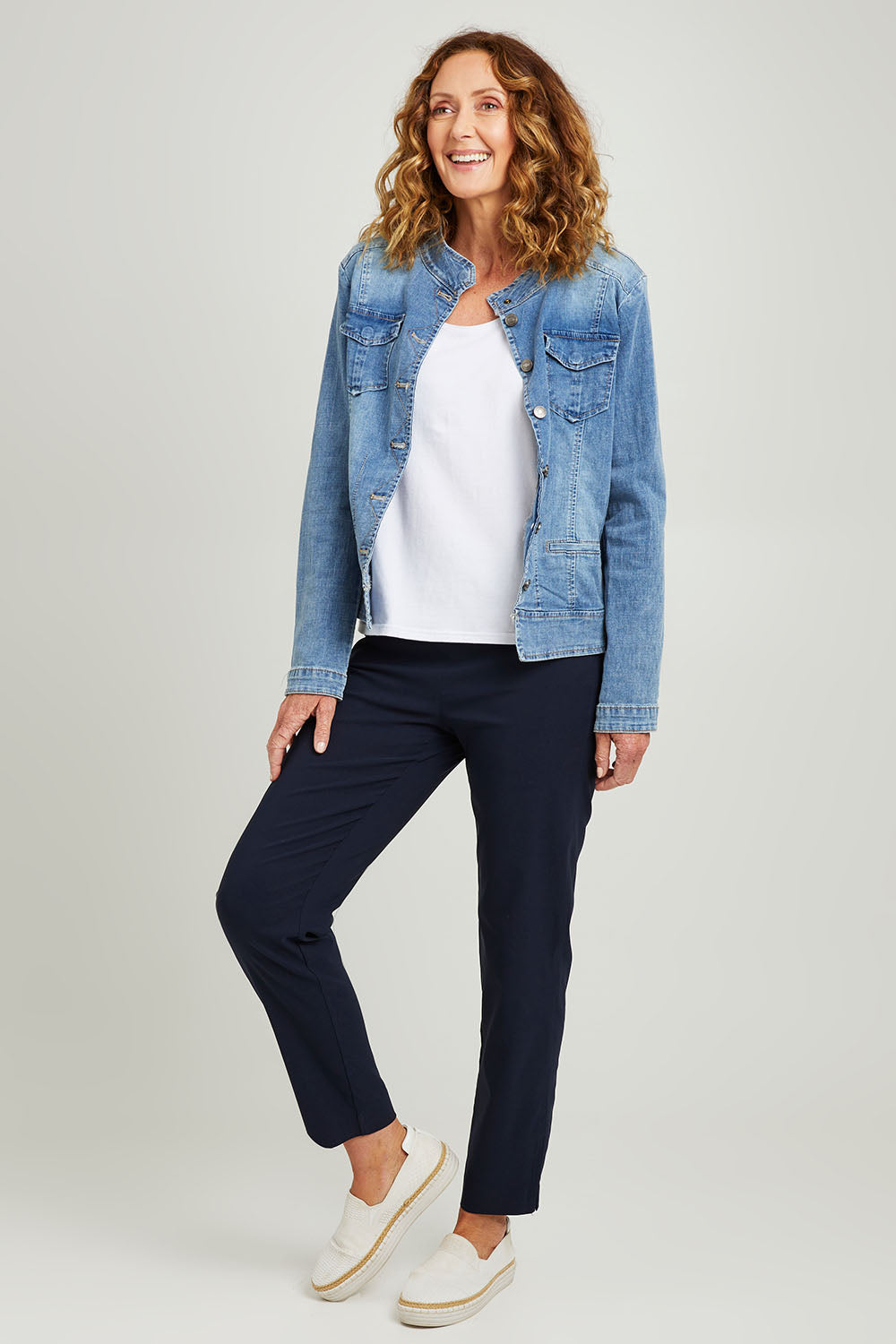 Model Emma wearing size S of the Maggie Denim Jacket in colour Denim (Blue), from the front, showing the whole outfit