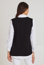 Model Madeline wearing size S of the Vicky Side Split Knit Vest in colour Black (Black), from the back