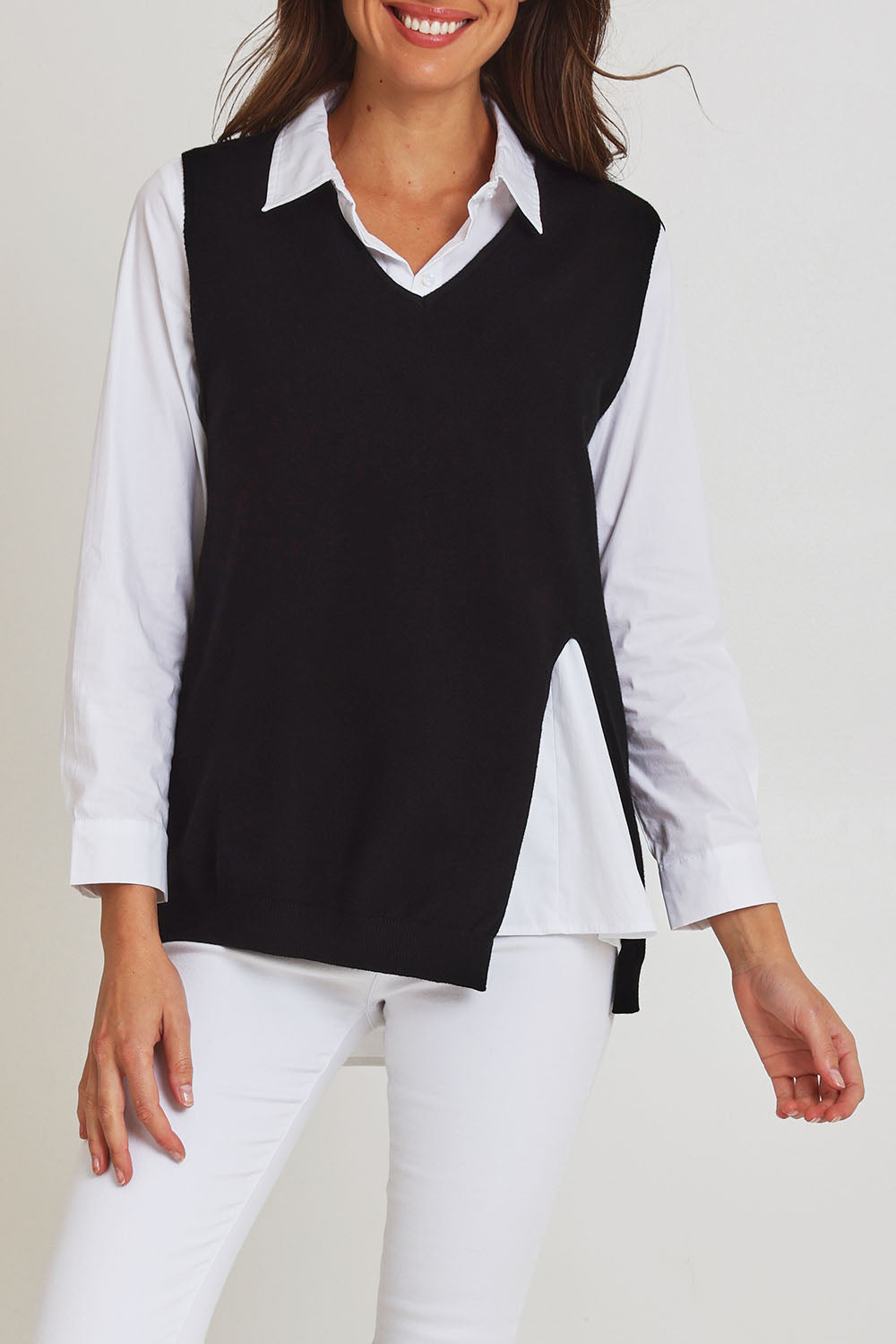 Model Madeline wearing size S of the Vicky Side Split Knit Vest in colour Black (Black), from the front, cropped image