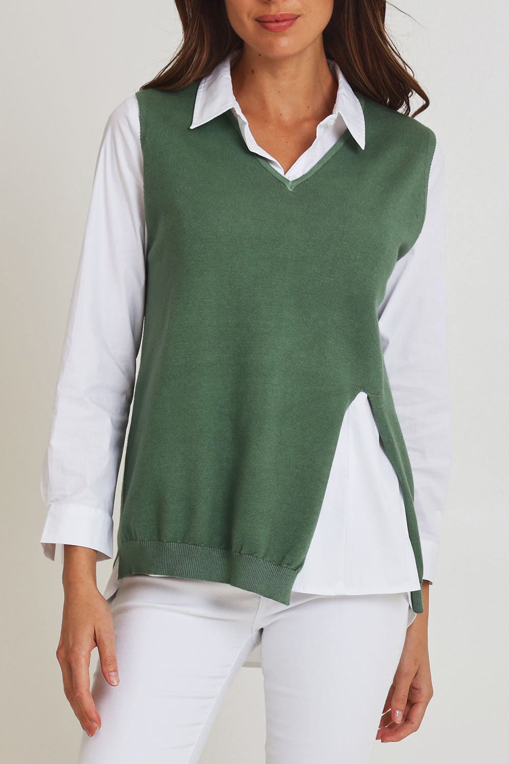 Model Madeline wearing size S of the Vicky Side Split Knit Vest in colour Khaki (Green), from the front, cropped image