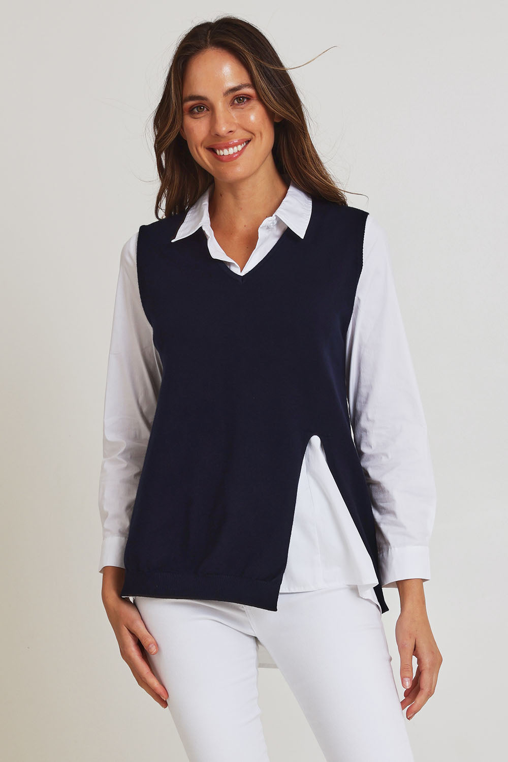 Model Madeline wearing size S of the Vicky Side Split Knit Vest in colour Navy (Blue), from the front, cropped image