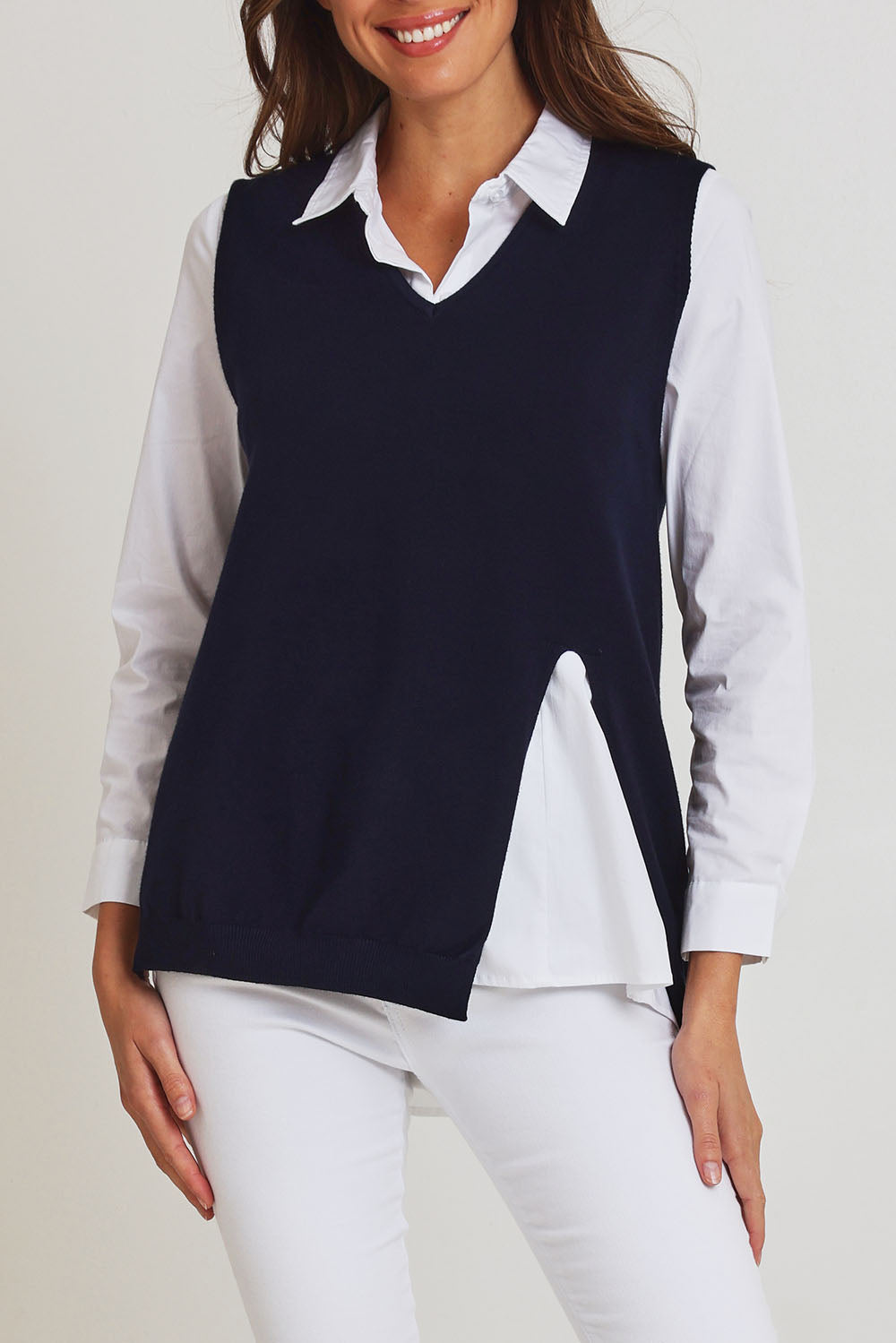 Model Madeline wearing size S of the Vicky Side Split Knit Vest in colour Navy (Blue), from the front, cropped image