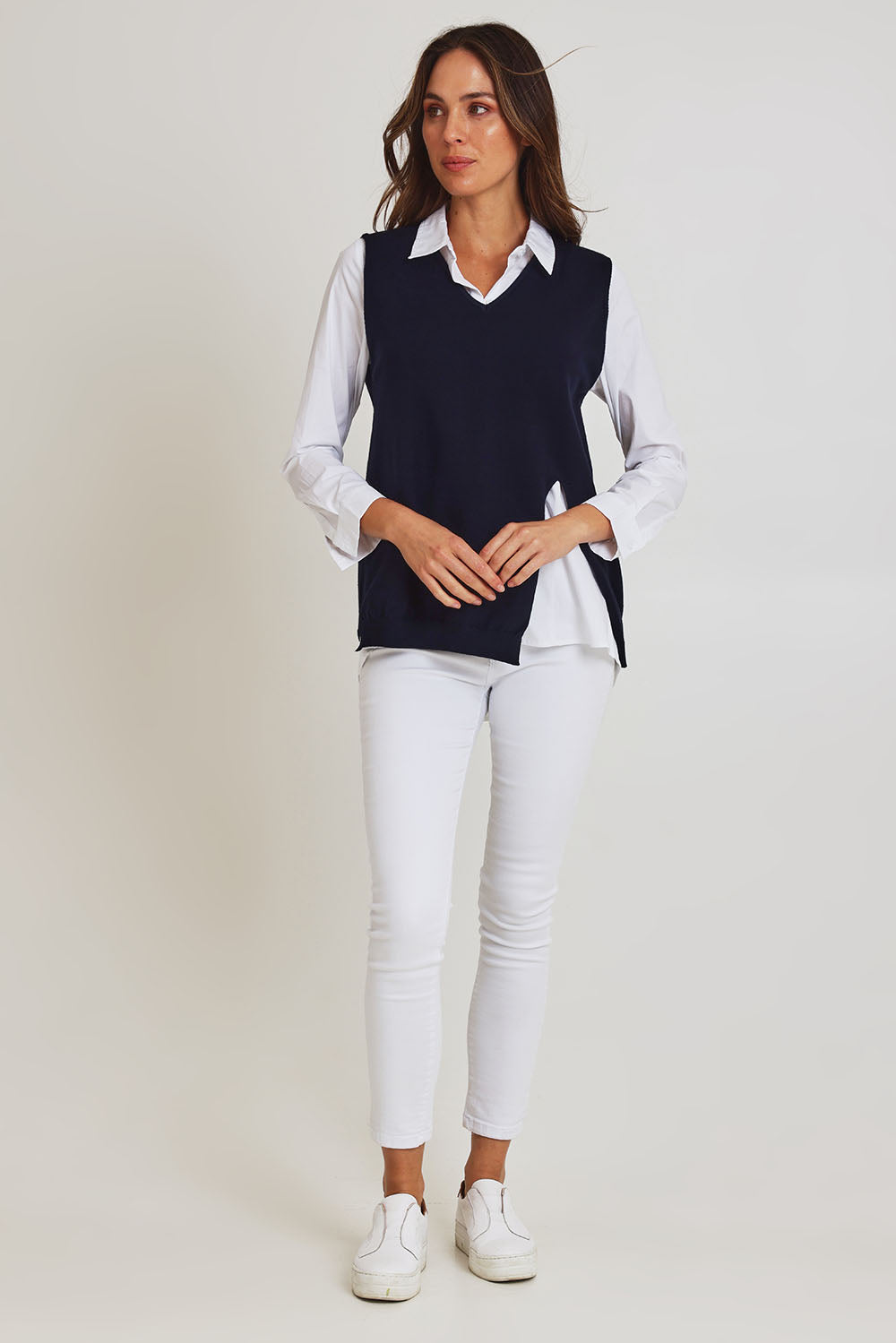 Model Madeline wearing size S of the Vicky Side Split Knit Vest in colour Navy (Blue), from the front, showing the whole outfit
