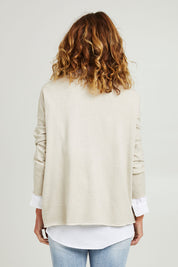 Model Emma wearing size S of the Amour Knit in colour Natural, from the back