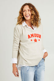Model Emma wearing size S of the Amour Knit in colour Natural, from the front, cropped image
