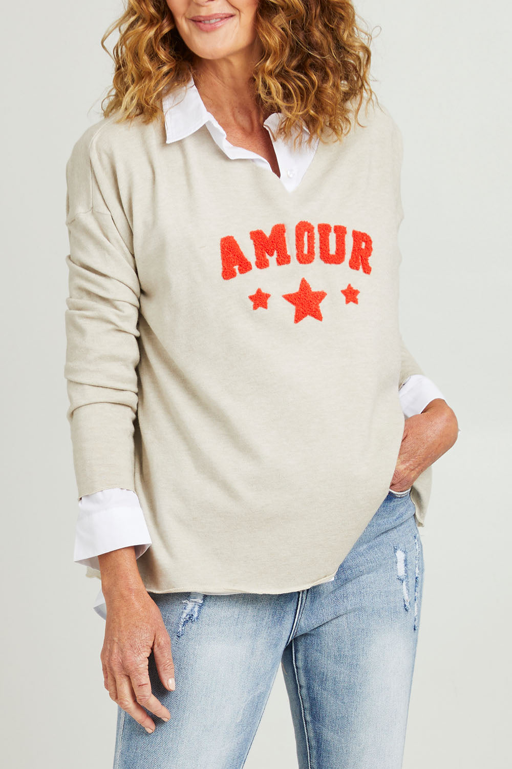 Model Emma wearing size S of the Amour Knit in colour Natural, from the front, cropped image