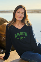 Model Alex wearing size S of the Amour Knit in colour Navy (Blue), from the front, showing the whole outfit