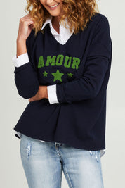 Model Emma wearing size S of the Amour Knit in colour Navy (Blue), from the front, cropped image