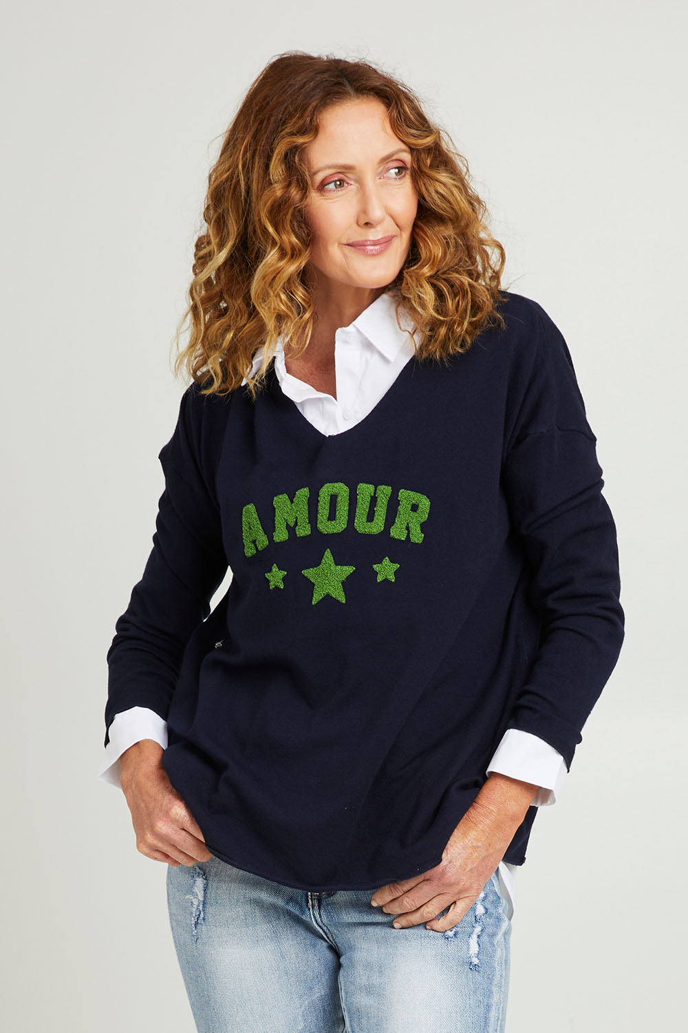 Model Emma wearing size S of the Amour Knit in colour Navy (Blue), from the front, cropped image