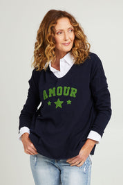 Model Emma wearing size S of the Amour Knit in colour Navy (Blue), from the front, cropped image