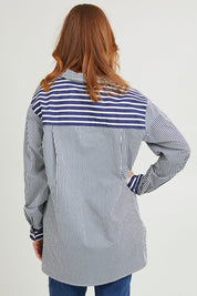 Model Katie wearing size S of the Anna Stripe Shirt in colour Navy (Blue), from the back