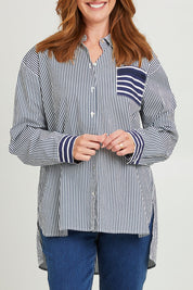 Model Katie wearing size S of the Anna Stripe Shirt in colour Navy (Blue), from the front, cropped image