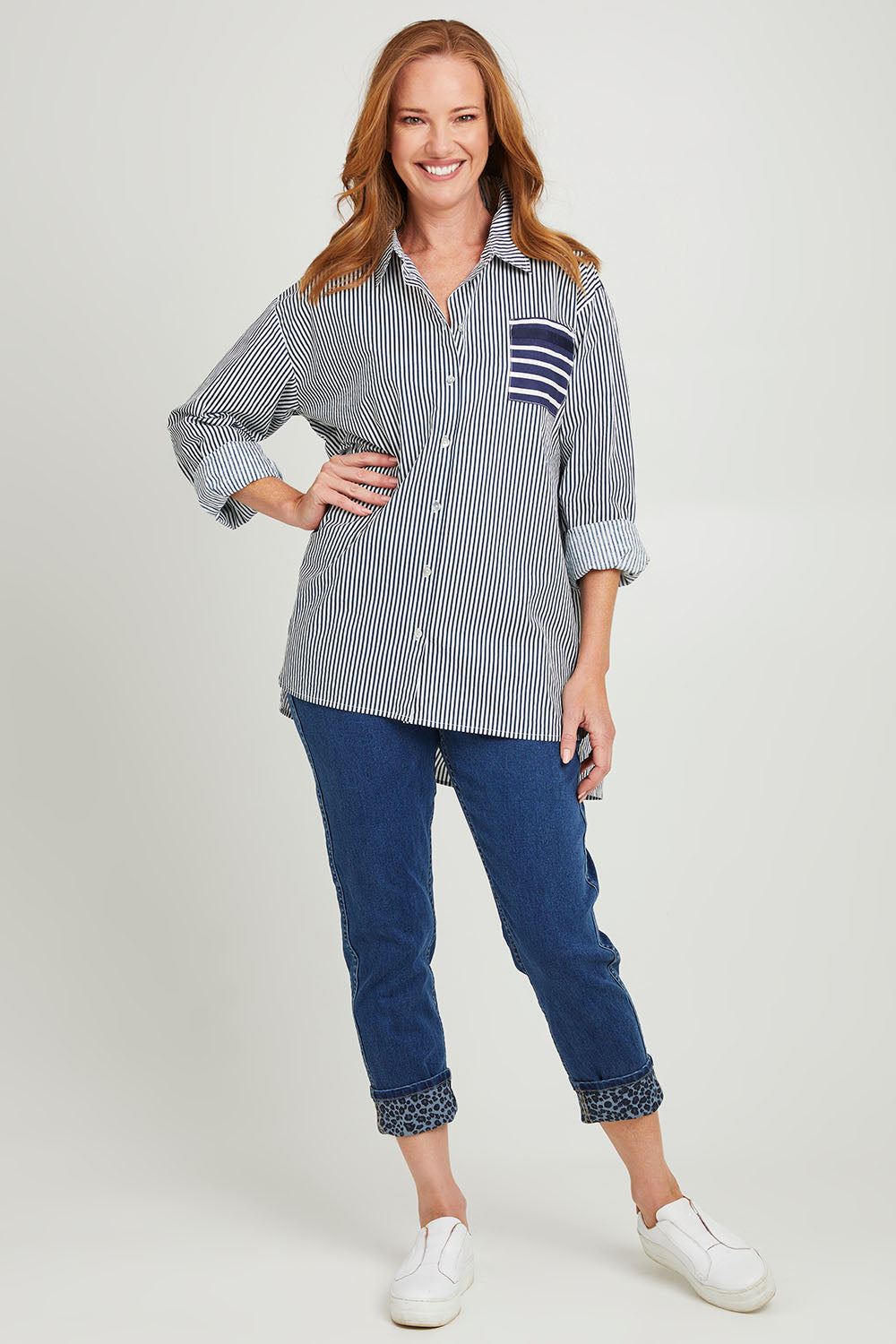 Model Katie wearing size S of the Anna Stripe Shirt in colour Navy (Blue), from the front, showing the whole outfit