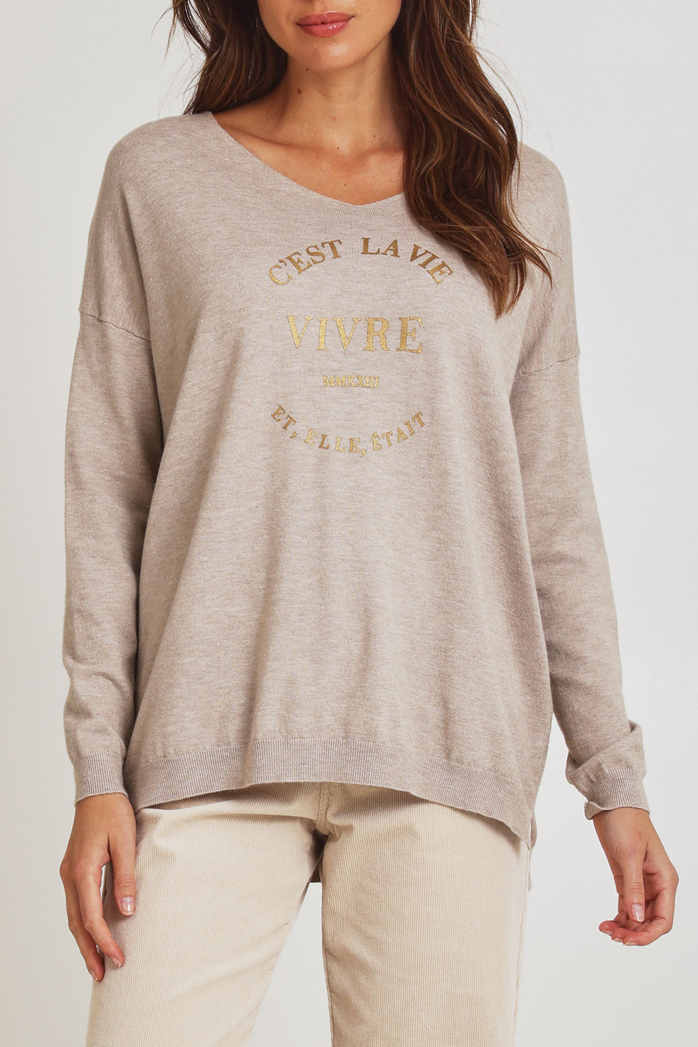 Model Madeline wearing size S of the Cest La Vie Knit in colour Natural, from the front, cropped image