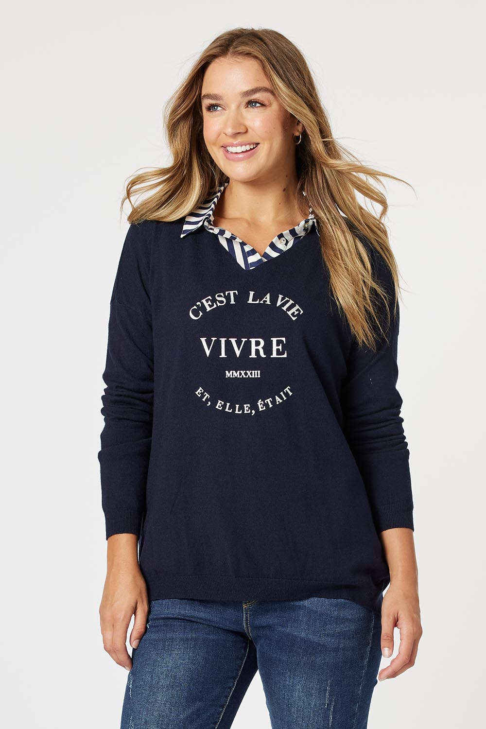 A model wearing the Cest La Vie Knit in colour Navy (Blue), from the front, cropped image