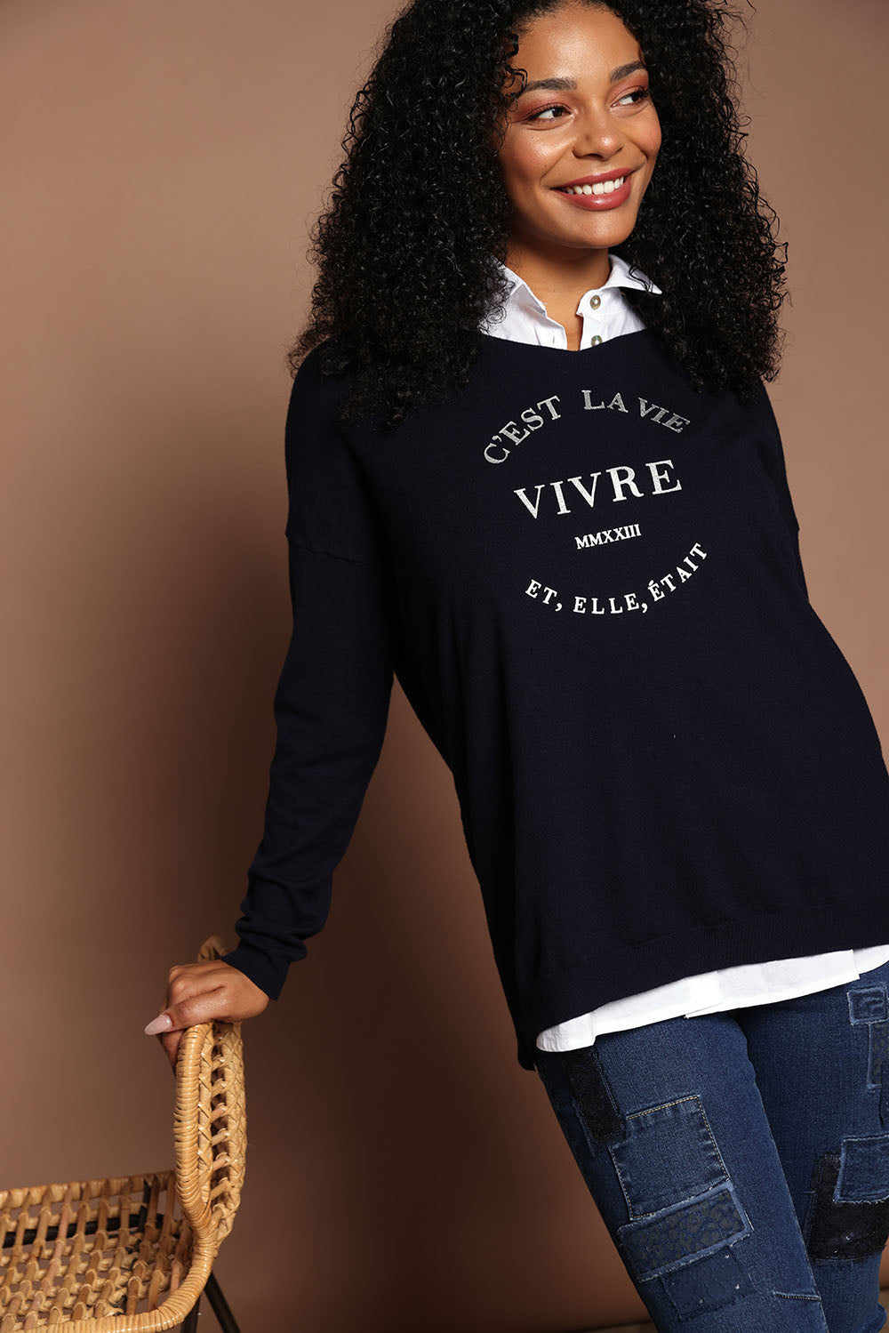 Model Ziara wearing size S of the Cest La Vie Knit in colour Navy (Blue), from the front, showing the whole outfit