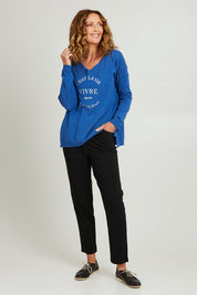 Model Emma wearing size S of the Cest La Vie Knit in colour Sapphire (Blue), from the front, showing the whole outfit