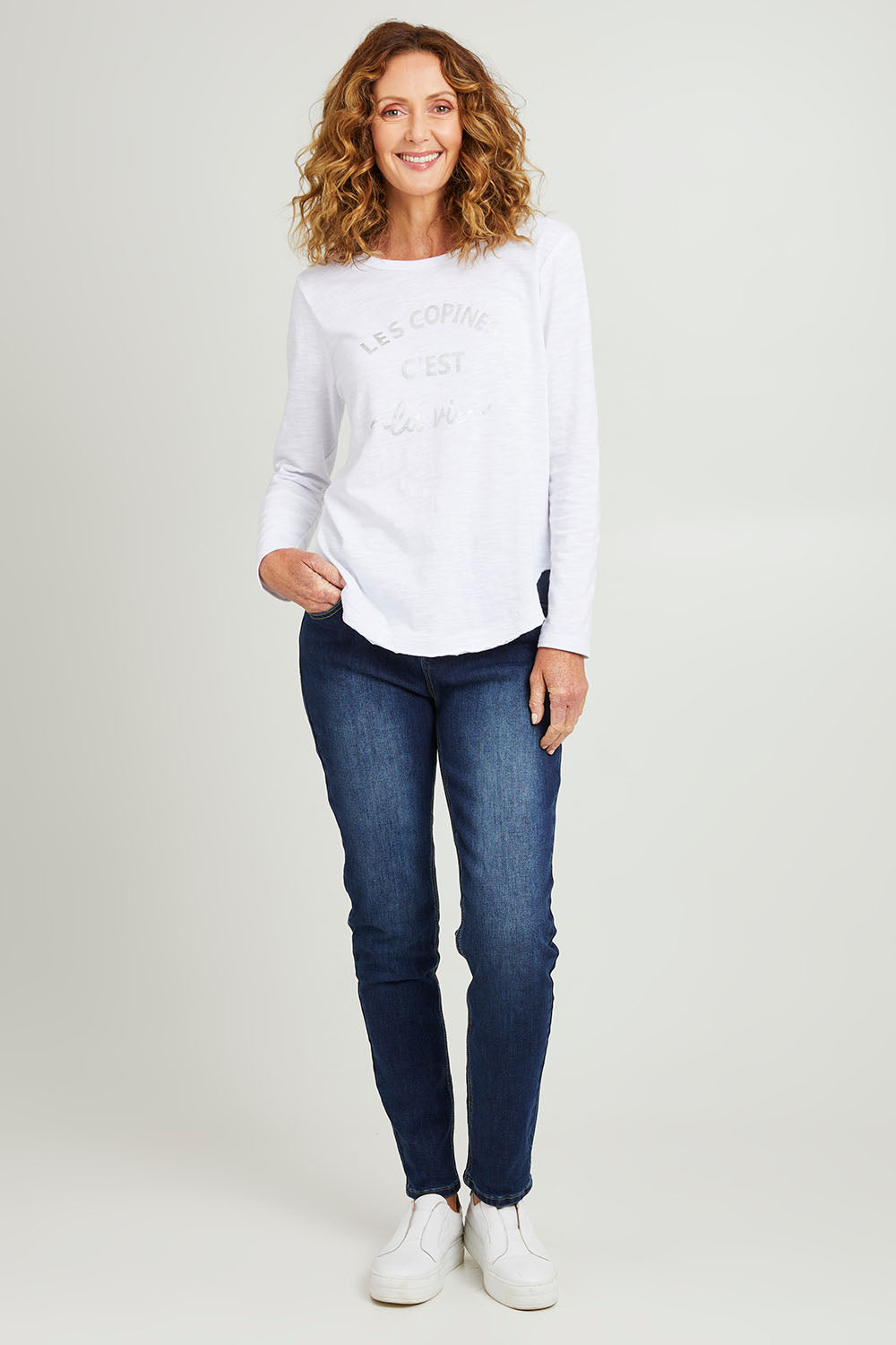 Model Emma wearing size S of the Les Copines L/S Tin colourShirt - White (White), from the front, showing the whole outfit