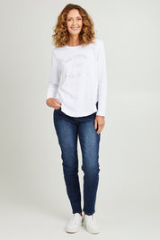 Model Emma wearing size S of the Les Copines L/S Tin colourShirt - White (White), from the front, showing the whole outfit