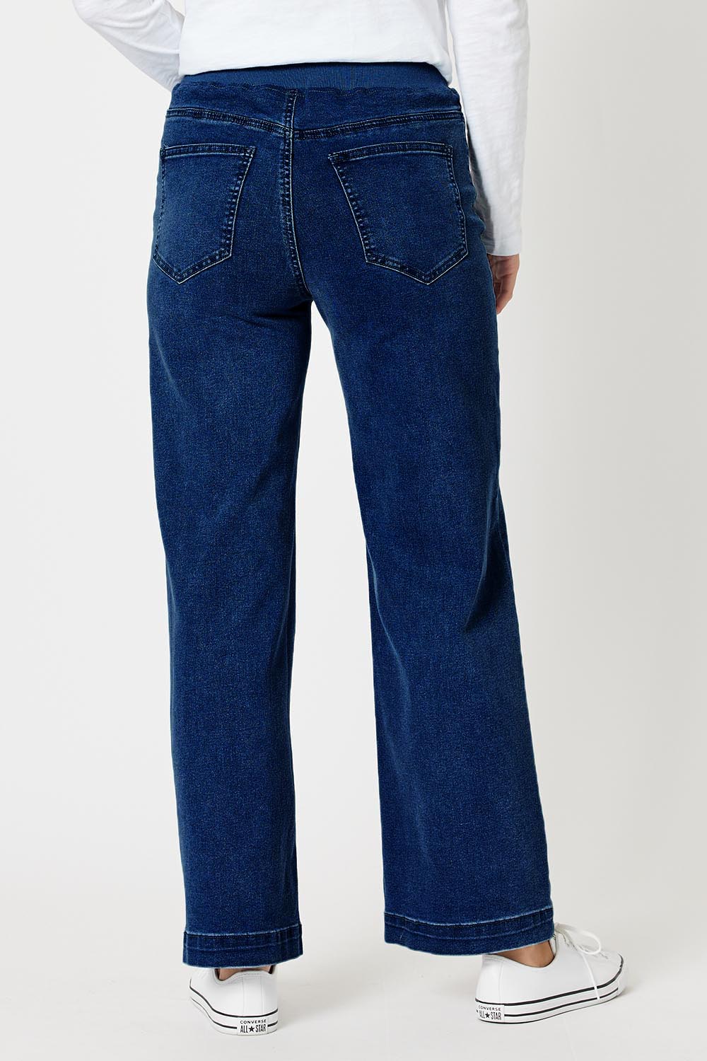 A model wearing the Maddy Wide Leg Jean in colour Darkdenim (Blue), from the back