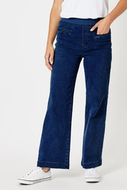 A model wearing the Maddy Wide Leg Jean in colour Darkdenim (Blue), from the front, cropped image